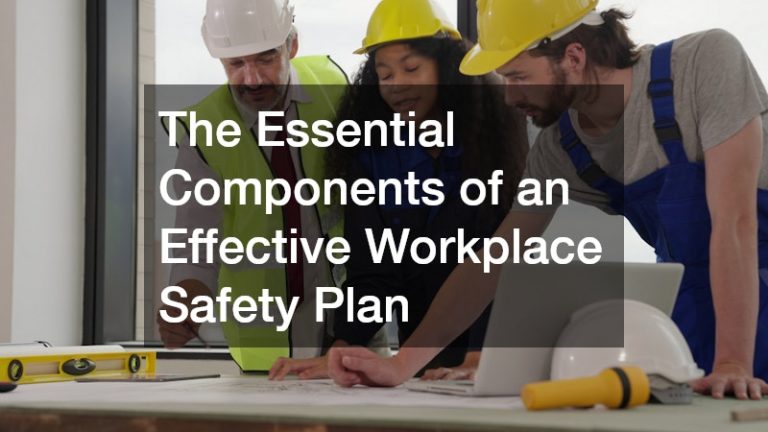 workers looking at a construction and safety plan